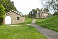 The trackbed running east through the former Lartington station in rural Teesdale on 11 May 2006, showing the well preserved goods shed and station building. [Ref query 6615]<br><br>[John Furnevel 11/05/2006]