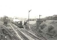 NB J37 0-6-0 64584 brings a westbound freight through Aidrie station on 26 August 1958. For the scene fifty six years on [see image 47271]. <br><br>[G H Robin collection by courtesy of the Mitchell Library, Glasgow 26/08/1958]