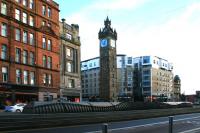 The grey and vaguely train-like shape of the 1979 cover for the former Glasgow Central Railway station at Glasgow Cross in January 2014. During the planning of the reopening of what became the Argyle Line, it was decided to construct a new station further west along Argyle Street. The site of the old station can still be seen from trains travelling between Argyle Street and Bridgeton.<br><br>[Colin McDonald 31/01/2014]