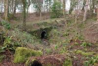 The trackbed south of Glenside station passes over a culvert, seen here on 30 January. To the north, the single 'main line' has been infilled and graded to meet the level of the goods yard for caravan park purposes.<br><br>[Colin Miller 30/01/2015]