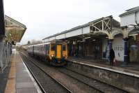 156423, on a Piccadilly to Chester service, calls at Platform 4 at Altrincham on 13th January. The gaps in the canopies mark the removal of the old footbridge, its accessible replacement having recently been commissioned. I would expect the missing sections to be replaced as part of the project.<br><br>[Mark Bartlett 13/01/2015]