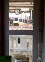 Brief exposure: looking South out of the famous (and recommended) re-opened Refreshment Rooms at Carnforth in January 2015, everything is nostalgic - arguably including the class 156 on the right, which has just come off the Cumbrian Coast line.<br><br>[Ken Strachan 28/01/2015]