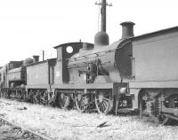 Wainwright 'C' class 0-6-0 no 31061, built at Ashford Works in 1901. Following withdrawal from Feltham 60 years later the veteran is here awaiting its fate on the scrapline at Eastleigh in August 1961. 31061 was finally cut up in the nearby works during October that year.<br><br>[K A Gray 13/08/1961]