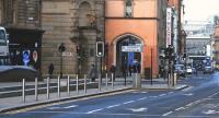 View from Glasgow Cross (with the plinth covering site of the former station on the left) along Trongate and Argyle Street to Central Station (right background) on 21 January 2015. Argyle Street Station entrance is out of sight behind various items of street furniture.<br><br>[Colin McDonald 21/01/2015]