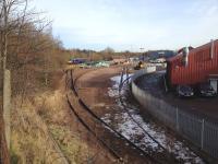 A westbound class 334 passes the little used sidings at Shettleston which are now part of the Torrent Trackside depot. On the other side of the yellow gate, a refuge siding beside the running lines is in daily use, but there is little sign of the stub of the former Glasgow, Bothwell, Hamilton and Coatbridge Railway.<br><br>[Colin McDonald 07/02/2015]