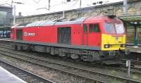 DB Schenker class 60, 60020 pauses briefly at Carlisle station on 26 November 2014 during a Carlisle to Warrington Arpley light engine move.<br><br>[Ken Browne 26/11/2014]