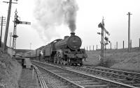 A B1 double-header leaving Kelso station westbound in the 1950s, with St Margarets based 61357 leading. Nothing remains of this scene today with the trackbed now forming part of the A698 road. [See image 42438] [Ref query 6618] <br><br>[Bruce McCartney Collection //]