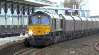 GBRf 66748 (purchased from Dutch Railways) photographed passing through Kilmarnock with loaded coal hoppers from Hunterston to Drax power station on 4 February 2015.<br><br>[Ken Browne 04/02/2015]