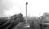 An unidentified B1 approaching the north end of Doncaster station with a brake van in February 1963.<br><br>[K A Gray 24/02/1963]