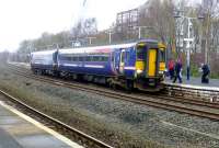 The 10.12 Glasgow Central to Carlisle calls at Kilmarnock on 11 February 2015. Note that this unit has had the 'First' logos painted over.<br><br>[Colin Miller 11/02/2015]