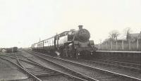 BR Standard tank 80020 calls at Auchnagatt on 9 April 1955 with an Aberdeen bound train. <br><br>[G H Robin collection by courtesy of the Mitchell Library, Glasgow 09/04/1955]