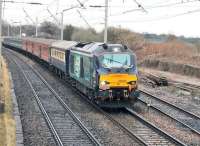 A <I>Six Nations</I> special from Carmarthen to Edinburgh, in connection with the Scotland-Wales match two days later, runs north through Hest Bank behind DRS 68005 <I>Defiant</I> on Friday 13th February 2015. The train was scheduled to return south again the following Monday.<br><br>[Mark Bartlett 13/02/2015]