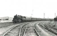 BR Standard class 4 2-6-0 no 76091 approaching Coatbridge Junction in the summer of 1961 with a Balloch - Coatbridge train. [Ref query 38460]  <br><br>[G H Robin collection by courtesy of the Mitchell Library, Glasgow 01/08/1961]