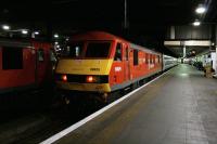 Preparing to depart for Aberdeen, Inverness and Fort William, the Highland Sleeper  has just been brought in to London Euston platform 15 by freshly painted DB Schenker locomotive 90029 on 10th February 2015. The 18-coach train will be hauled as far as Waverley by 90018, seen waiting alongside on platform 16.  Serco will take over the Caledonian Sleepers on 31st March 2015.<br><br>[Colin McDonald 10/02/2015]