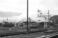 LMS 5025 leaves Aviemore, bound for Boat of Garten in 1975 with LCGB's <I>The Grampian</I>, having taken over from the class 26s parked at the island platform.<br><br>[Bill Roberton //1975]