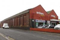 There were two tram depots in Ayr, one on each side of Bellesleyhill Road, in the north of the town. This is the southern example, operating as a <I>Bed Superstore</I> in February 2015. [See image 50389]<br><br>[Colin Miller 16/02/2015]