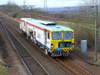 An SB Rail tamper passing the former Camps Junction on 16 February en route from Carstairs to Millerhill.<br><br>[Bill Roberton 16/02/2015]