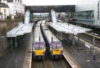 View west over Haymarket station on 18 February 2015 with the revamp now complete. About to leave platform 4 is the 1437 Edinburgh - Milngavie, while at the adjacent platform 3 is the 1240 Helensburgh Central - Edinburgh. Arriving at platform 1 in the right background is the 1351 service from Glenrothes with Thornton.  <br><br>[John Furnevel 18/02/2015]