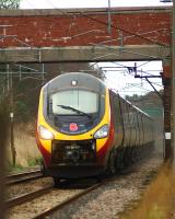 Virgin Pendolino 390103 <I>Virgin Hero</I> heads south at Woodacre with the 1M10 0940 Glasgow to Euston service on 14 February 2015. The cover over the retracted coupler is missing as was the one on the other end of the set.<br><br>[John McIntyre 14/02/2015]