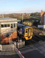 A Lancaster to Leeds working passes the disused signal box at Hest Bank on 17 February heading for Carnforth. Trains usually pass over the crossing at high speed but 158908 had just come off the Morecambe branch chord at around 15mph making it easier to capture. <br><br>[Mark Bartlett 17/02/2015]