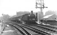The BLS Bathgate & District Railtour waiting to leave Maryhill Central on 6 May 1961. The special visited various branches between Glasgow and Bathgate before finishing the tour at Glasgow Queen Street. The 3 coach train was hauled throughout by Eastfield shed's N15 0-6-2T 69163. [See image 48701] <br><br>[G H Robin collection by courtesy of the Mitchell Library, Glasgow 06/05/1961]