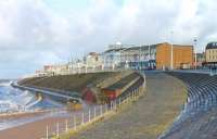 Blackpool <I>Flexity</I> 012 heads along the elevated north promenade at Blackpool. Below the promenade the collonades on the <I>Middle Walk</I> can be seen and also the more exposed <I>Lower Walk</I>. <br><br>[Mark Bartlett 21/02/2015]