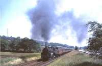 Hard working BR Standard class 5 4-6-0 no 73060 comes slowly over the summit of Neilston Bank on Saturday 17 July 1965 with a Glasgow Fair special.   <br><br>[John Robin 17/07/1965]