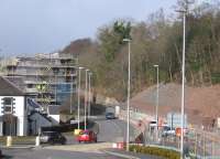 Nearly five years on from my photograph in April 2010 [see image 28730], in this view north from Station Brae on 24th February 2015 one building has been demolished to make way for the railway, while another's construction is steadily progressing in the shape of the new Galashiels Transport Interchange - and the single platform railway station is also taking shape. Thanks to lobbying by the Campaign for Borders Rail, the maximum waiting time for signals to allow passengers to cross the intervening A7 road will be just 30 seconds.<br><br>[David Spaven 24/02/2015]