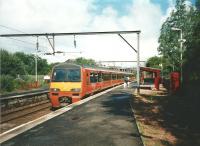 Hunting pink is red, red tape is pink, and Strathclyde red is... orange. While it looked OK on older stock it doesn't to me seem quite right on a 320, or is this just with hindsight? At Barnill in June 1998 320302 calls with a Milngavie service.<br>
<br><br>[David Panton 04/06/1998]