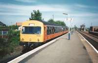 DMU 101689 slips into the bay platform at Barrhead on 4 June 1998 with a stopping Service from Glasgow Central. It nust have been a warm day as every window appears to be fully open (those were the days). Another bygone is people opening the door before the train came to a stop, as is happening here.<br>
<br><br>[David Panton 04/06/1998]