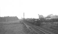 One of Kittybrewster shed's B1 4-6-0s no 61343 heading north west out of Aberdeen in the summer of 1950. The train is between the sites of Woodside and Persley stations (both closed 1937) with a train for Elgin. [Ref query 7794]  <br><br>[G H Robin collection by courtesy of the Mitchell Library, Glasgow 11/07/1950]