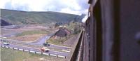 Photograph taken from the footplate of Fairburn 2-6-4 tank 42693, one of Beattock shed's duty bankers, on 31 July 1965. The train is crossing Harthope Viaduct over the recently dualled A74.<br><br>[John Robin 31/07/1965]