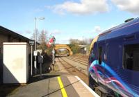 FGW 180106 departing Moreton-in-Marsh on 27 February, about to pass a GWR lower quadrant signal.<br><br>[Peter Todd 27/02/2015]