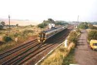 A Glasgow Queen Street - Edinburgh Waverley service passes Cadder signal box on 16 September 1998.<br><br>[David Panton 16/09/1998]