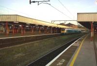 A class 175 and a Virgin Voyager await the off at Stockport on a Saturday evening in April 2011.<br><br>[Ken Strachan 24/04/2011]