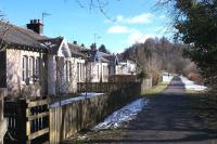The railway cottages just east of the site of Aberfoyle station on the trackbed of the former Strathendrick and Aberfoyle Railway seen on 4th March 2015. The line is now a popular walking route to Buchlyvie.<br><br>[Colin McDonald 04/03/2015]