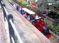The Brookside Miniature Railway is located in a garden centre on the outskirts of Poynton, Cheshire. This unusual view is taken from the pavement of the adjacent main road in May 2012, during a Railway Ramblers exploration of the area.<br><br>[Ken Strachan 12/05/2012]