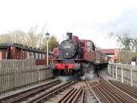 The Swindon and Cricklade Railway's new loco at work. Recently puurchased from the Spa Valley Railway, it is a Polish TK 0-6-0T, imported sometime in the 1990's. The new addition is seen here departing Blunsdon station with a train on 7 March.<br><br>[Peter Todd 07/03/2015]