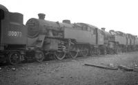 Standard 2-6-4 tanks awaiting disposal at Carstairs in October 1964 include 80073 and 80071, withdrawn from here in November 1963 and July 1964 respectively. Both were cut up in the yard of Motherwell Machinery and Scrap, Wishaw, during 1965. <br><br>[K A Gray 29/10/1964]