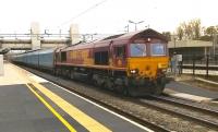 66198 heads North through Bletchley on 20 February with a train of enclosed car carrying wagons.<br><br>[Ken Strachan 20/02/2015]