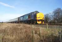 On 7 March 2015 a railtour visited the Ormskirk branch from Preston. An 8 coach train with Class 37 locos at each end was quite a sight for a line that is used to one or two coach railcars and brought out many locals to see this <I>unusual</I> spectacle. The tour is seen here at Ulnes Walton returning to Preston with 37419 on the rear for this leg of the journey.<br><br>[John McIntyre 07/03/2015]