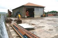 The old goods yard at Newton Stewart in May 2007, now part of a plant hire operation, with the former goods shed still performing a useful function 42 years after closure of the line.<br><br>[John Furnevel 31/05/2007]