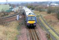 A Sunday morning Glasgow Queen Street - Edinburgh Waverley service diverted around the 'sub' due to engineering works at Haymarket tunnel on 2 April 2006. The train is at Niddrie West Junction running onto the single line section to Brunstane and Portobello to eventually enter Waverley station from the east.<br><br>[John Furnevel 02/04/2006]