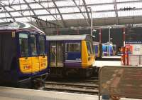 View from the concourse at Liverpool Lime Street on 12 March 2015 showing 5 different unit types at the buffer stops. From left to right are classes 319, 142, 150, 185 and 156.<br><br>[John McIntyre 12/03/2015]