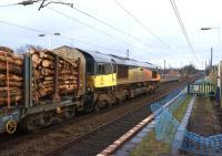 Colas 66849 <I>Wylam Dilly</I> heads south at Leyland on 9 March 2015 with the Carlisle to Chirk log train. On the right work is underway to extend platform 1 in connection with the plan to run fewer but longer trains to Manchester during the work on Farnworth tunnel from May to October this year. [See image 50273]<br><br>[John McIntyre 09/03/2015]