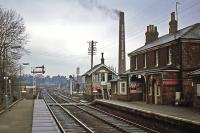 A westward view through a rather grimey Mistley station towards Manningtree on 29th January 1978. At the time, the station was still manned and the landmark EDME chimney stack was adding to the grime. Major change arrived in the 1980s when the line to Harwich was electrified and the signaling modernized. In 1985, the signal box was moved to the East Anglian Railway Museum at Chappell and Wakes Colne. The main building has since been cleaned and looks much fresher.<br><br>[Mark Dufton 29/01/1978]