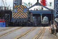 In a race against an ebbing tide, 08460 has an uphill struggle to unload the Zeebrugge-Harwich train ferry on 25th March 1979. The ferry had arrived almost too late to unload, but after the ship made a smart reversal up to the dock worthy of a newspaper delivery van, the loco was able to nip on and drag the load up the rapidly worsening gradient in the nick of time. <br><br>[Mark Dufton 25/03/1979]