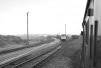 View from a train passing Stranraer Town yard on 7 February 1976, with a class 25 shunting.  [The long-disused sidings were being lifted in mid-March 2015.]<br><br>[Bill Roberton 07/02/1976]