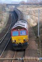 DBS 66093 slows for a signal check near the site of Silvermuir East Junction with the Dalston - Grangemouth empties on 19 March. Ravenstruther coal terminal is just beyond the bridge in the background.  <br><br>[Bill Roberton 19/03/2015]