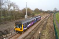 Leaving Newton Aycliffe for Heighington on 18 March 2015. What is not so obvious nowadays is the trackbed of the line that once ran towards Stockton, which now disappears into the vegetation beyond the GSMR tower.<br><br>[John McIntyre 18/03/2015]